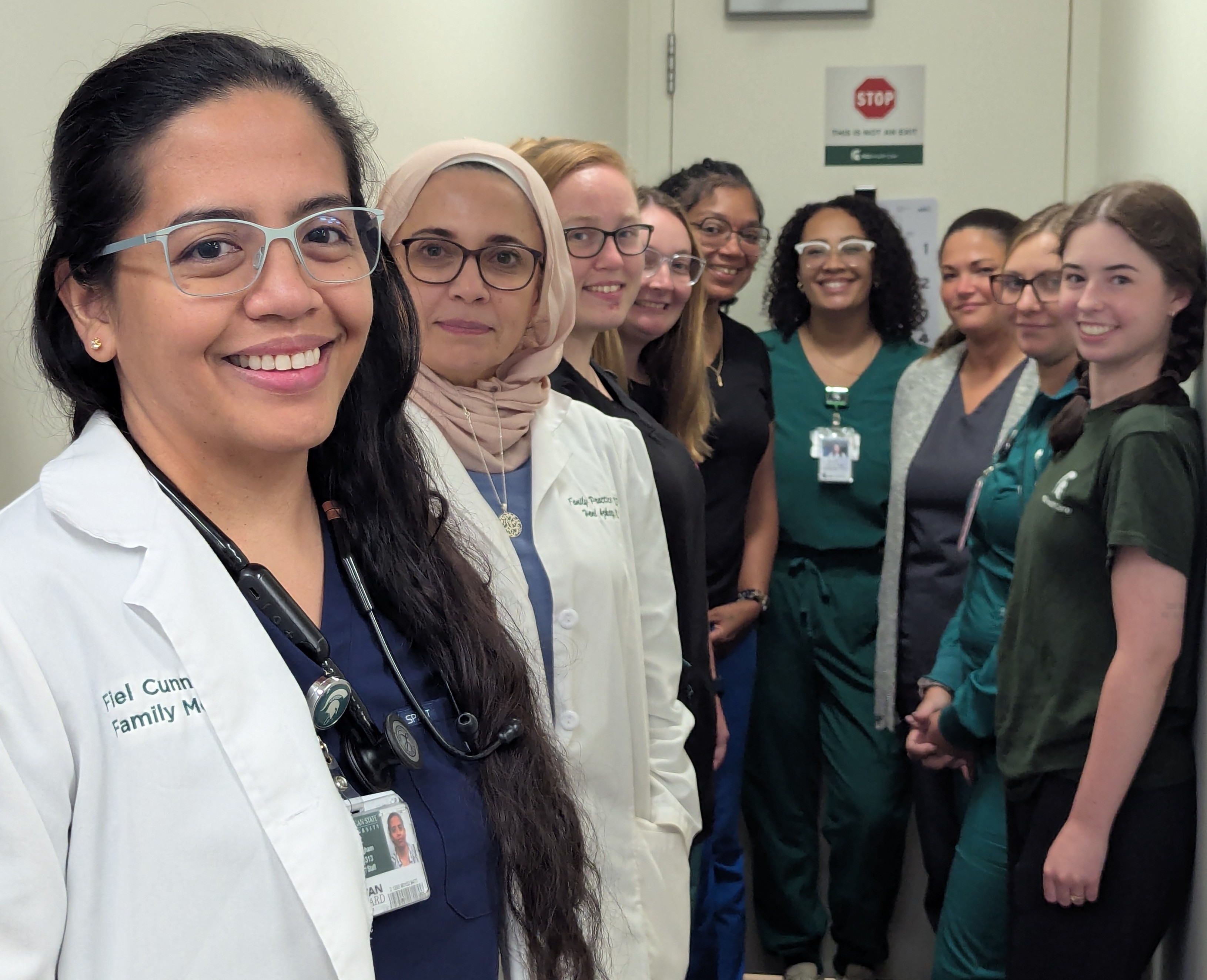 Drs. Fiel Cunnigham and Hend Azhary, with Clinic staff.
