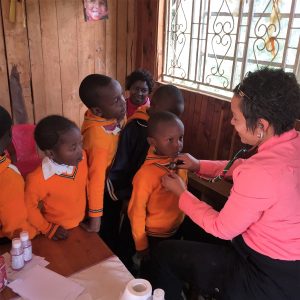 Kenya Sekoni helping children